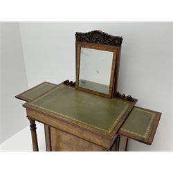 Early Victorian figured mahogany dressing cabinet, the raised shell and scroll carved back lifts to reveal rectangular easel mirror with mahogany band, flat rectangular top with tooled leather inset, slide at each side with matching leather inset, full width drawer above cupboard enclosing a series of five drawers, turned front supports, panelled front, sides and back