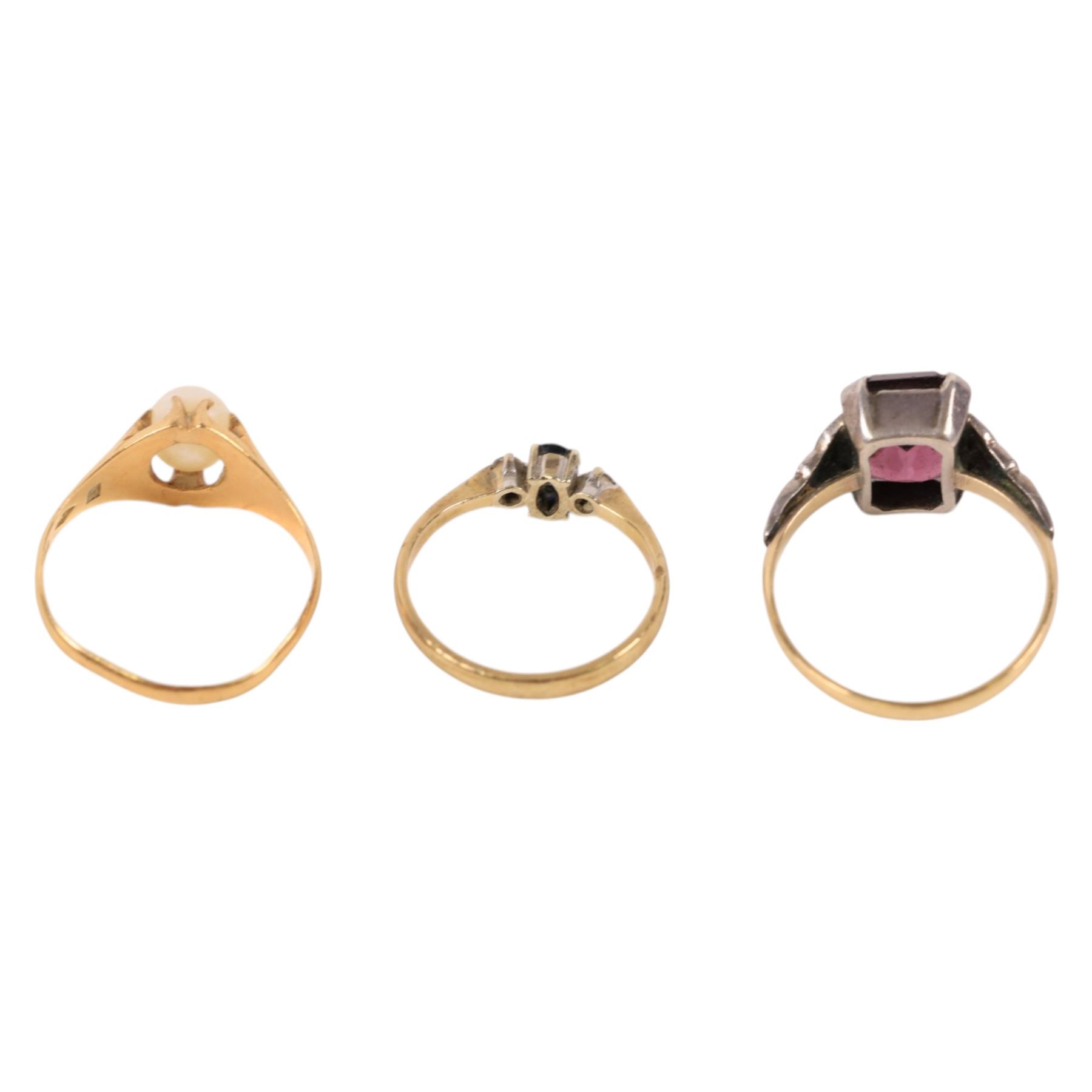 18ct gold faux pearl ring, 9ct gold stone set ring and a 9ct gold and silver stone set ring, all stamped or hallmarked