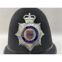 British Transport Police Custodian helmet with Queen's Crown plate; Hiatt & Co ebonised hardwood patrol truncheon; and pair of Hiatts 1960 hand-cuffs (3)