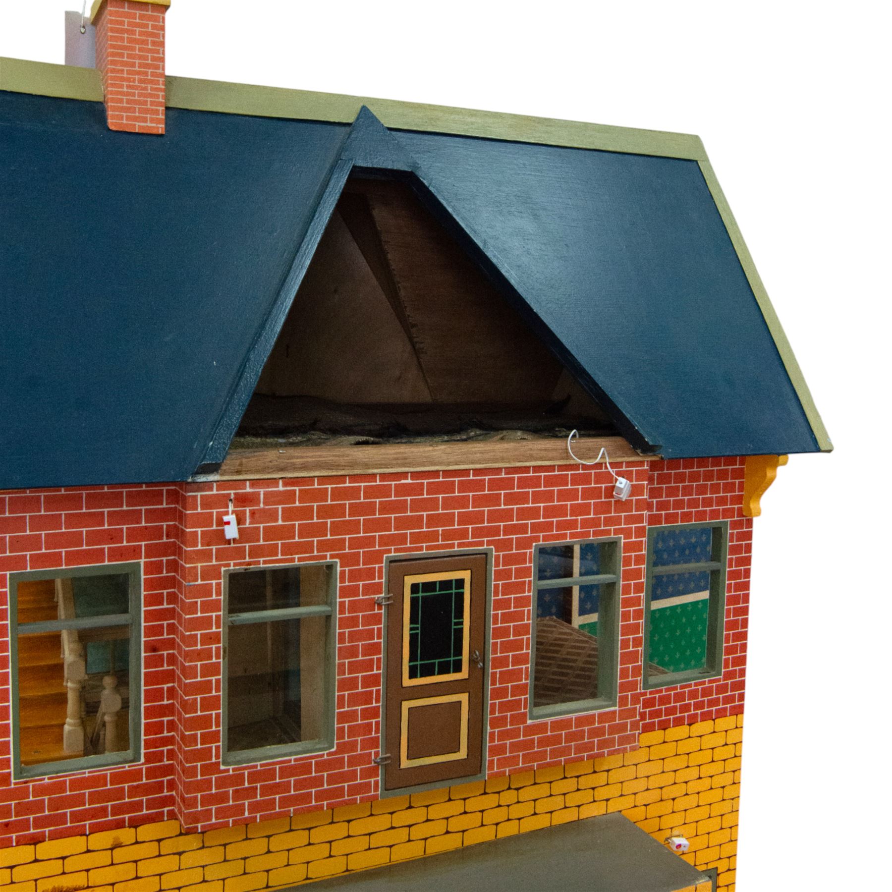 Moritz Gottschalk three storey wooden dolls house model 3589, with two side openings, with blue roof, painted exterior and wallpapered and painted interior, similar example featured in 'The Genius of Moritz Gottschalk' book, page 57, including chimney H100cm