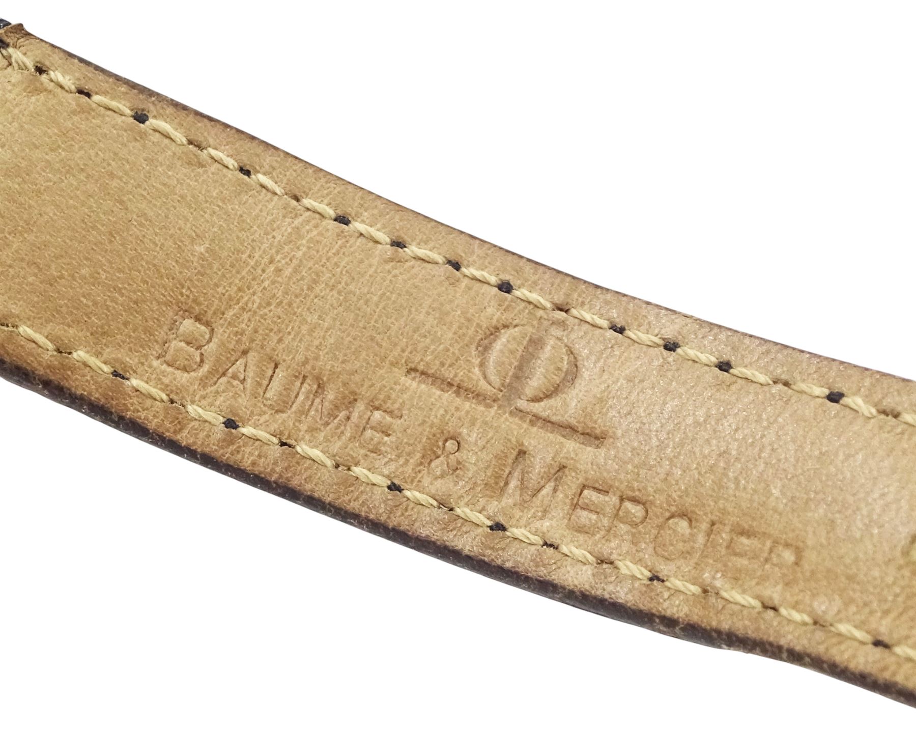 Baume & Mercier ladies 18ct gold quartz wristwatch, champagne dial with baton hour markers, hallmarked, on Baume & Mercier black leather strap, with gilt buckle, with guarantee card dated 1983