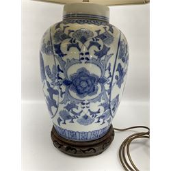 Chinese blue and white table lamp of baluster form, decorated with birds and floral displays, on hardwood base with shade, H78cm