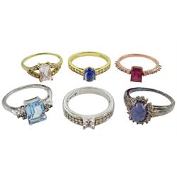 Six silver and silver-gilt stone set rings including ruby and topaz, kunzite and morganite, kyanite and topaz, tanzanite and topaz, blue and white topaz and white zircon, all stamped or tested