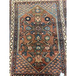 Small Persian rug or mat, decorated with Herati motifs within pattern borders 