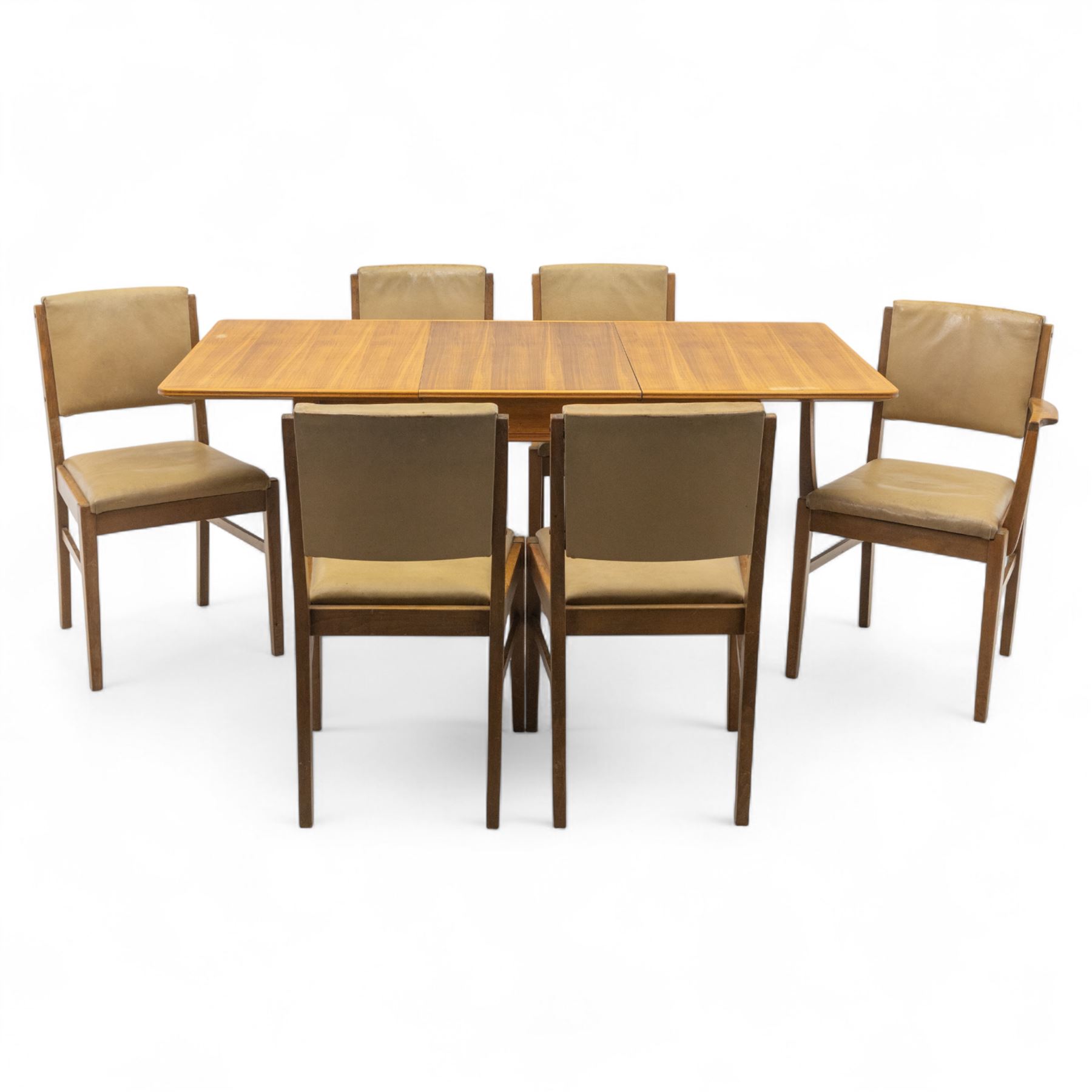 Gordon Russell - mid 20th century teak dining suite, comprising rectangular extending dining table and six matching chairs including one carver, each chair with padded upholstered seat and backrest in vinyl, on square supports, the table with plain top and rounded edges on tapered legs, an example of the firm’s functional post-war design with restrained modernist detailing (Chairs H 85cm, W 47cm, D 46cm) (Extends to 154cm)