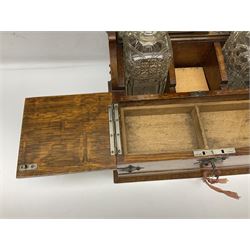 Victorian oak tantalus, mirrored high-back with recess for housing the decanters, behind a hinged box, with cribbage board to the concealed drawer below, marked Barman, London, H33cm, L37cm