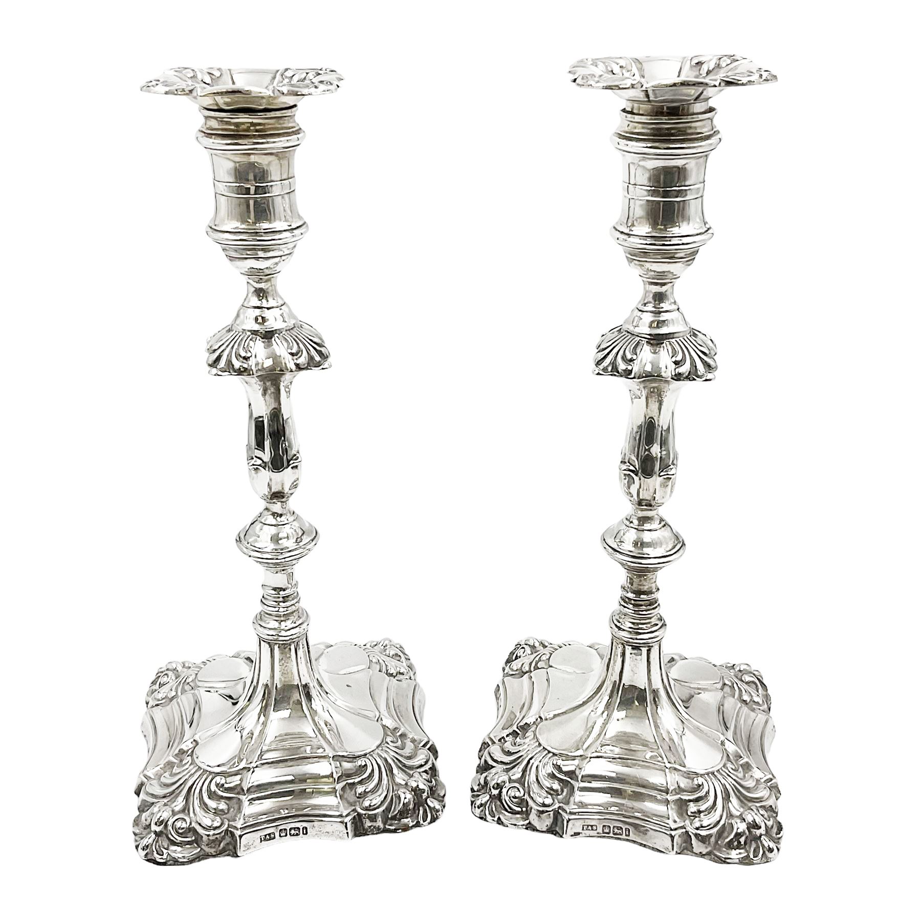 Pair of late Victorian silver mounted candlesticks, each of knopped and part fluted form, upon square stepped base with anthemions to each corner, with conforming sconces, hallmarked to removable sconces and foot, Thomas A Scott, Sheffield 1901, H25.2cm