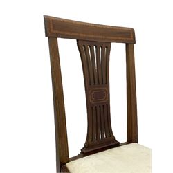 Set twelve (4+8) Edwardian inlaid mahogany dining chairs, cresting rail with satinwood banding, pierced splat backs with central inlay, drop-in seats upholstered in foliate patterned ivory fabric, raised on square tapering supports terminating in spade feet