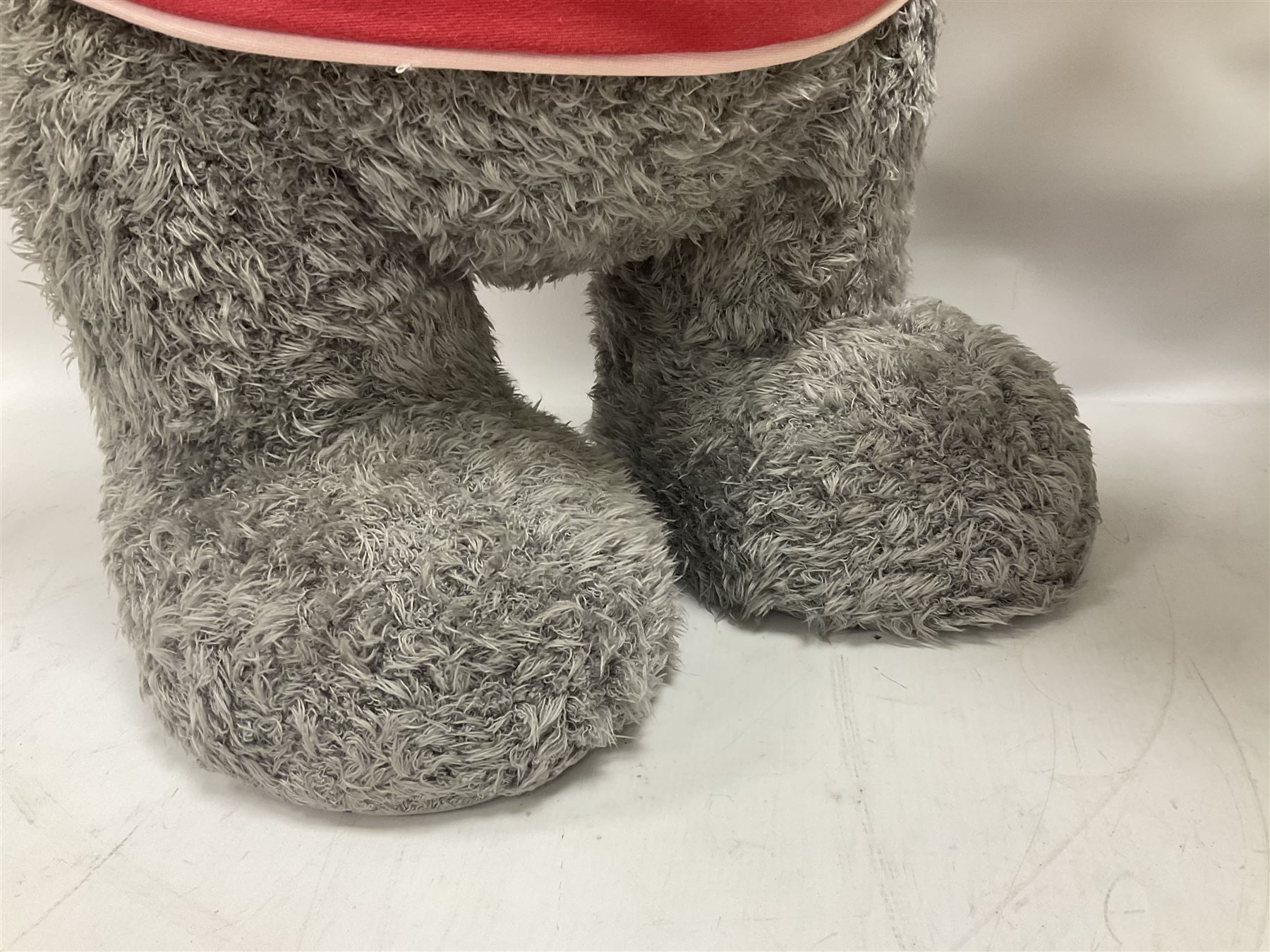 Scooter 2000 plastic battery operated remote control waiter robot with tray and remote control unit; together with a large 'Me To You' floor standing teddy bear (2)