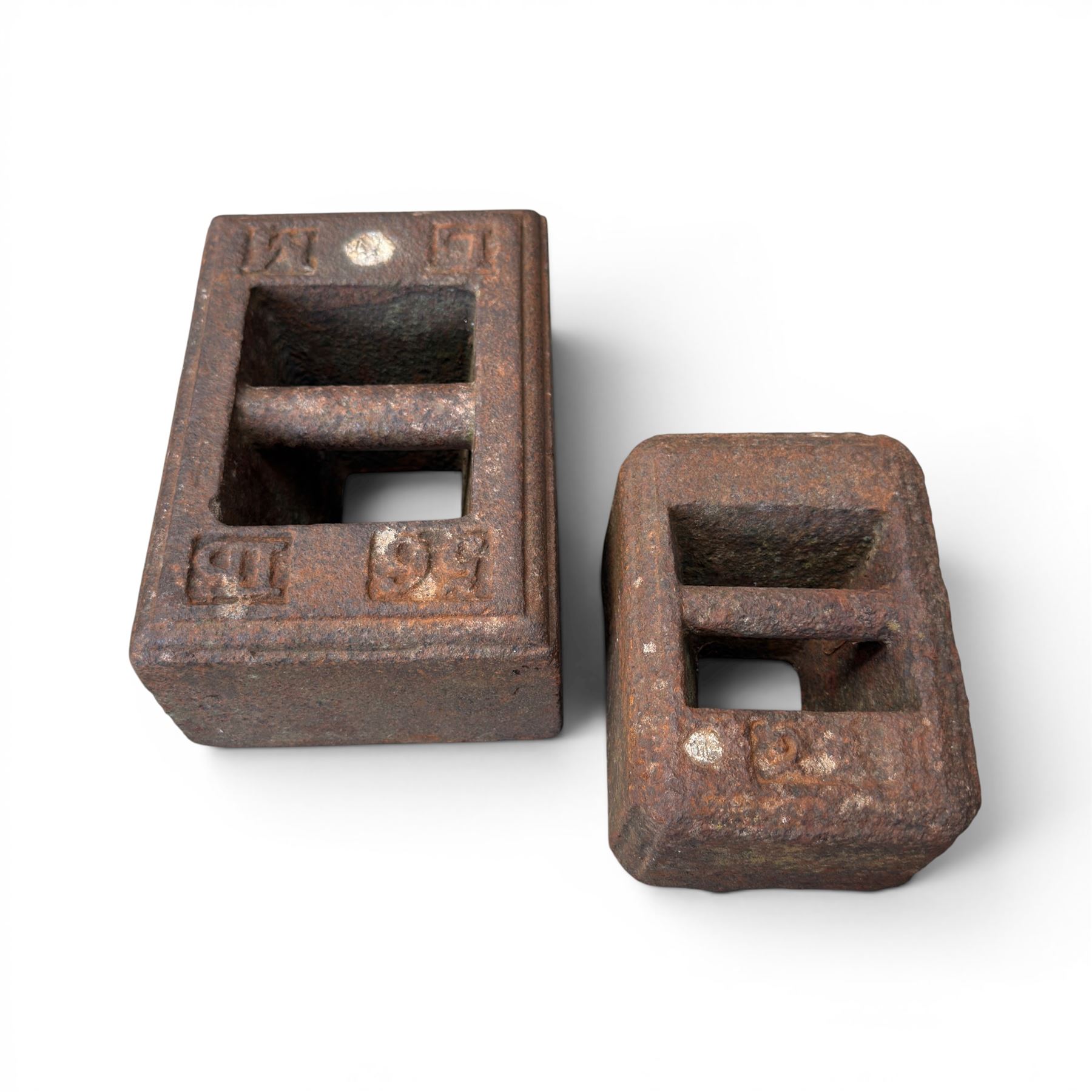  Cast iron corner manger along with one 56lb cast iron weight and another of unknown weight