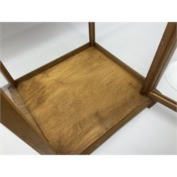 Tabletop glass display cabinet, with hinged door, together with two glass domes