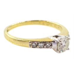 18ct gold single stone round brilliant cut diamond ring, with diamond set shoulders, London 1996, total diamond weight 0.33 carat