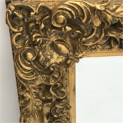 Bevelled edge mirror in ornate swept gilt frame,  69cm x 79cm