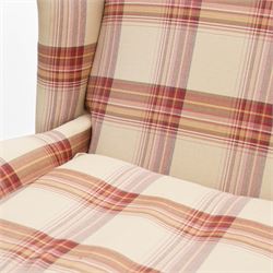 Laura Ashley - hardwood-framed wingback reclining armchair upholstered in checkered fabric, on turned and fluted front feet with brass cups and castors 