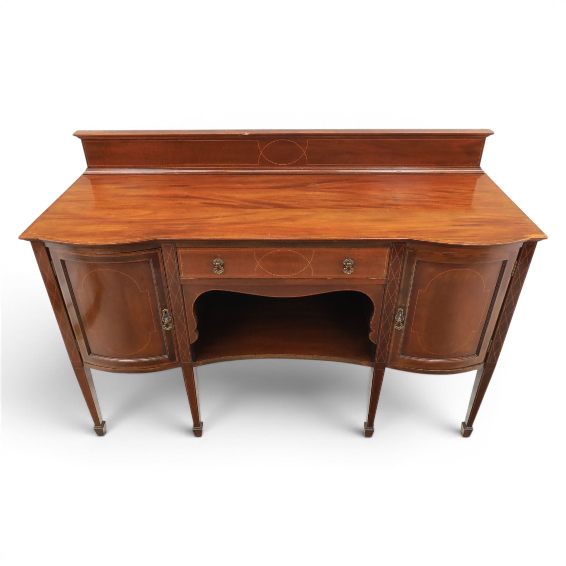 Edwardian mahogany and satinwood sideboard, shaped top with galleried back, with freize drawer flanked by two cabinets, united by undertier, raised on square tapering supports terminating in spade feet