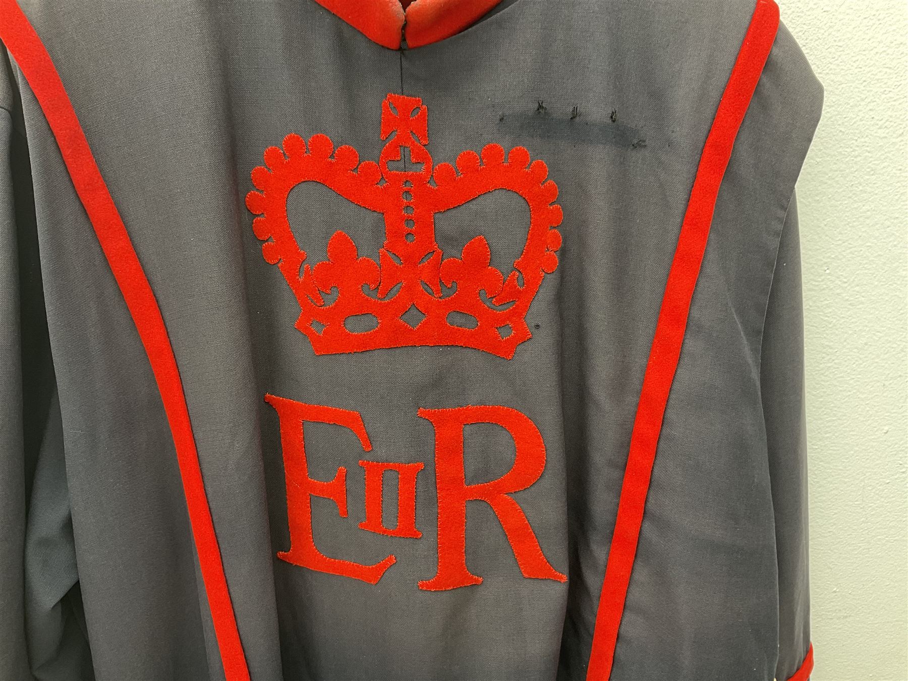 Elizabeth II Yeoman Warders (Beefeater) No.1 Undress blue uniform - comprising tunic bearing label Crown Military Uniforms H.M. Tower of London and bonnet by S. Patey (2) 