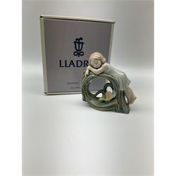 Collection of seven Lladro figures, including Seated ballerina with swan 6204, Childhood Dream 8129, Dancer 5050, reclining clown with ball alongside a selection of other figures. 