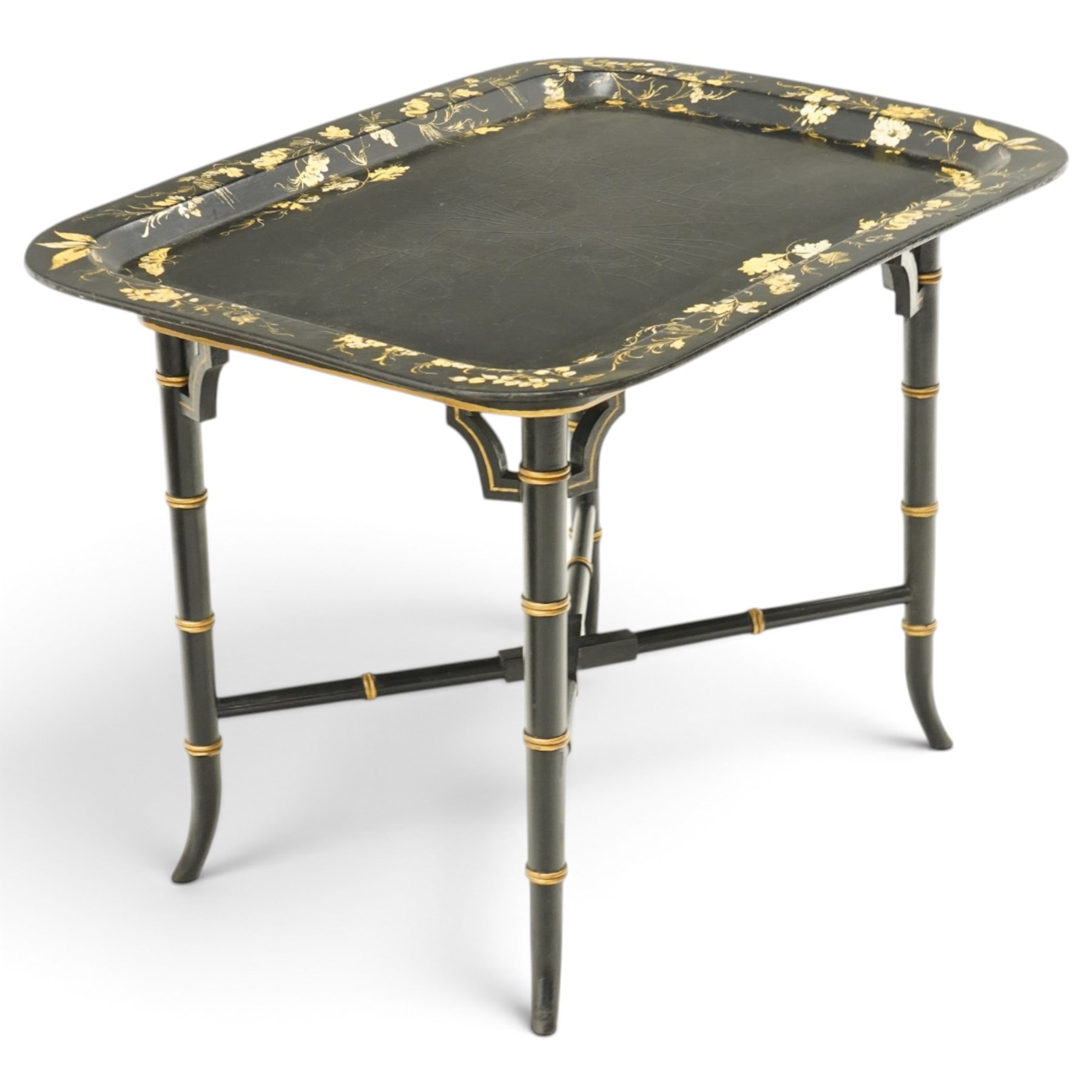 Victorian ebonised and gilt-painted papier-mâché tray on later ebonised and parcel-gilt simulated bamboo stand, the rectangular removable tray with gilt foliate and butterfly scenes with scrolling branches, the base on four ring-turned and splayed supports united by X-stretcher