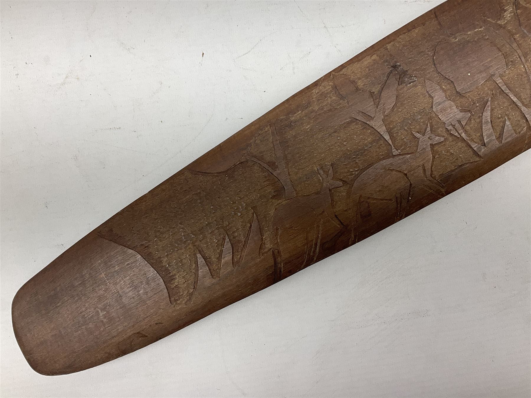 Australian Aboriginal shield, carved with Kangaroo and Emu, 74.5cm; Spear painted with aquatic creatures 78cm, and Spear thrower 81cm (3)