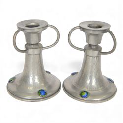 Pair of  Jugendstil hammered pewter candlestick each set with three blue and green enamel roundels, marked Germany beneath, H12cm