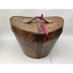 Leather hat box containing black felt top hat with 'British Manufacture' label, together with a grey top hat with 'Allens of Harrogate' label 