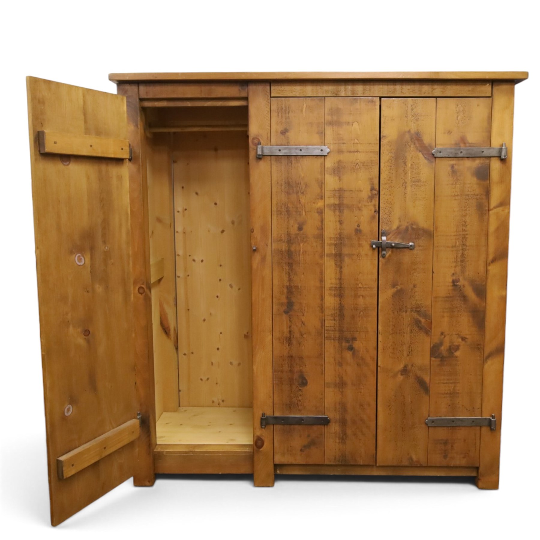 Indigo Furniture - rustic oak triple wardrobe, fitted with three doors with wrought metal fittings and locks, on style supports