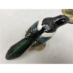 Three Beswick figures of birds, comprising pheasant no 1225, magpie no 2305 and woodpecker 1218, all with impressed marks beneath, tallest H22cm