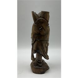 Chinese carved wooden figure of a traveller H36cm. 