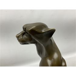 Bronze figure, modelled as a stylised sitting cheetah, signed Milo and with foundry mark, upon a black marble circular stepped base, overall H31.5cm