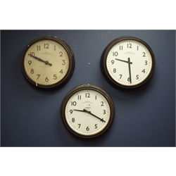  Three 1940s 'Smiths London' circular bakelite slave clocks, white Arabic dials, D37cm  