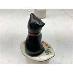 Five crested ware Good Luck black cats, comprising two Willow Art examples, two Arcadian examples and one Carlton China, to include Bridlington, Hull, Filey, etc, tallest H9cm