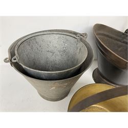 Two vintage galvanised watering cans, three galvanised buckets and a brass jam pan