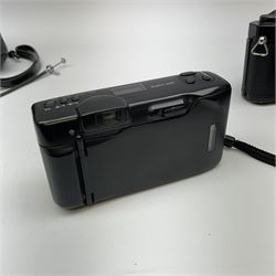 Nikon FM 35mm SLR camera body, Sigma 28-300mm 1:3.5-6.3 lens, Cosina 100mm 1:3.5 macro lens, two macro adaptors, instruction manual, Nikon 'Lite-Touch zoom' 35mm camera, and three relating carrying cases