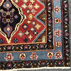  Persian style red and blue ground rug, repeating border, 131cm x 85cm  