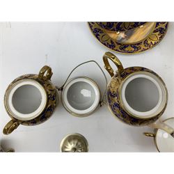 Noritake tea service for four, decorated with desert camel scene with blue border and gilding, comprising four teacups and saucers, four side plates, lidded sucrier, teapot and jug, together with twin handled pedestal bowl etc (19 pcs) 