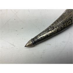 Indian Khanjar dagger with 28cm curving damascus steel blade inlaid with silver floral emblem, white metal and niello style grip in the form of a bird's head with pronounced beak and matching scabbard L44cm overall