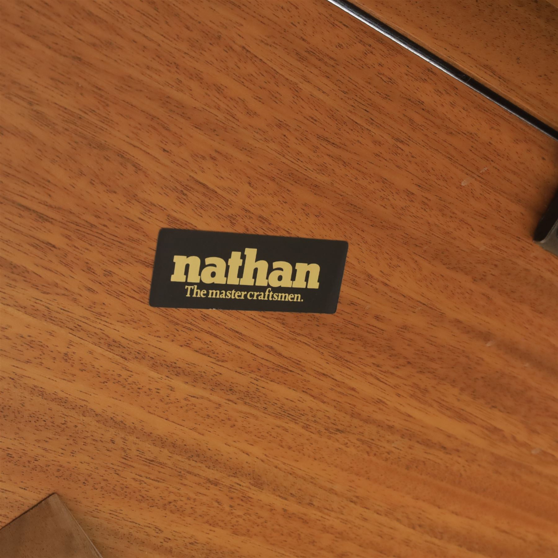 Nathan - teak drop leaf dining table, the rectangular top with rounded corners fitted with twin hinged drop leaves and gate legs, extended to form an oval table 174cm in length, raised on square section supports united by stretchers