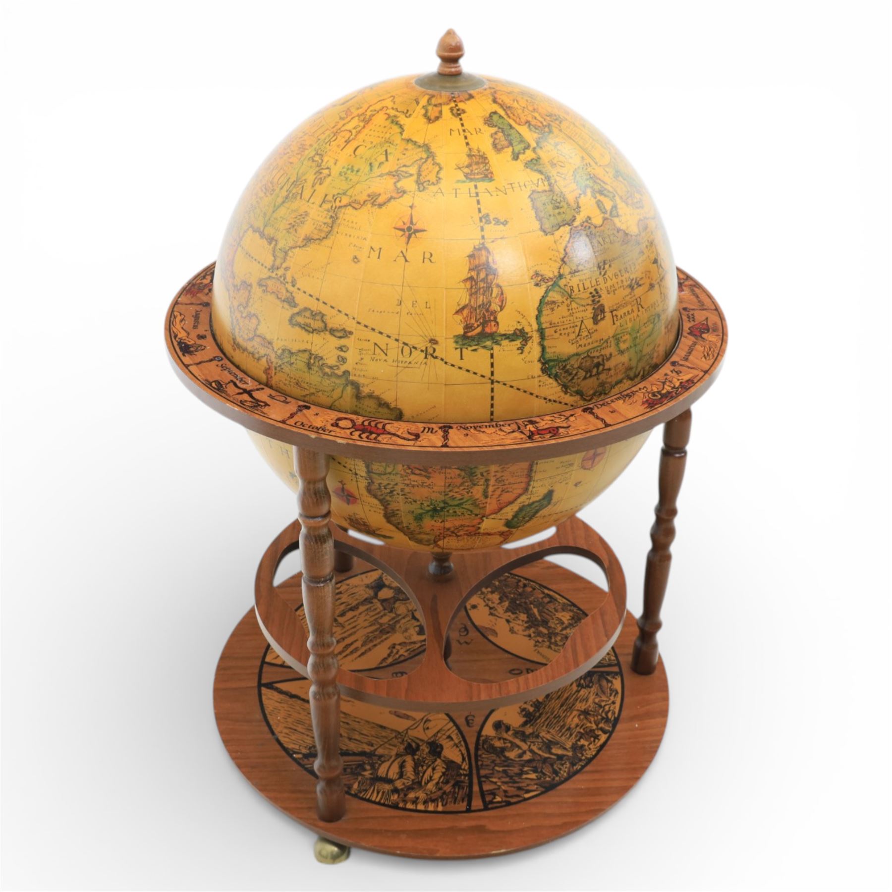 Late 20th century drinks globe, with lift off top with rotating inside with apertures for bottles, raised on brass castors
