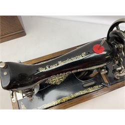 Singer sewing machine in wood case with key
