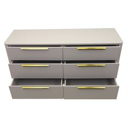 Made.com - 'Ebro' grey six drawer chest, gold painted metal shaped handles, rounded corners with fluted detail, raised on gold painted metal tapered supports