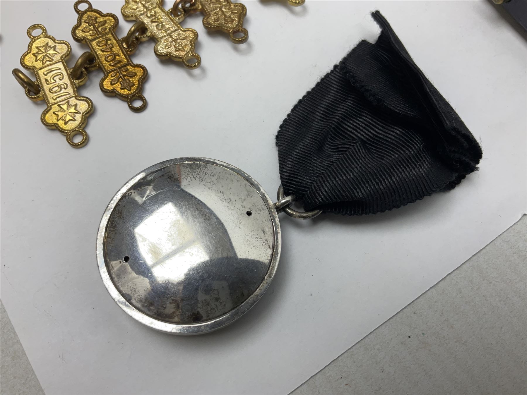 Four St John's silver fobs, together with two silver Directors Ambulance shield fobs and two other St Johns items 