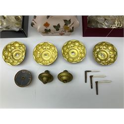 Large quantity of brass finished door knop handles and drop handles, together with a 20th century pink glass lamp shade decorated with butterflies and fruiting vines, ceiling shade fittings, two brass greyhound fire dogs, and four gilt curtain rings, in one box 