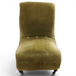 Victorian mahogany framed slipper chair, of reclined shape with rolled back over sprung seat, raised on turned feet with ceramic castors