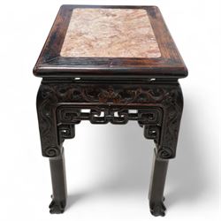Early 20th century Chinese carved hardwood and marble urn stand, rectangular moulded top with inset variegated rouge marble, carved with curling leafy branches and scrolls, shaped and pierced brackets, on ball and claw carved supports 