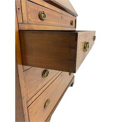 Edwardian inlaid mahogany bureau, shaped raised back, the moulded fall front inlaid with large urn motif and flanked by extending scrolling foliage, interior fitted with correspondence divisions, small drawers and pen and ink stand, with inset leather writing surface, four graduating drawers below, satinwood banding throughout, on bracket feet