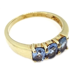  9ct gold three stone blue topaz ring, hallmarked  
