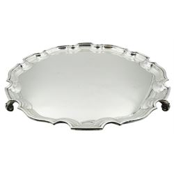 1930's silver salver, of circular form with pie crust edge, upon three scroll feet, hallmarked Adie Brothers Ltd, Birmingham 1934, D31cm, approximate weight 30.47 ozt (948 grams)