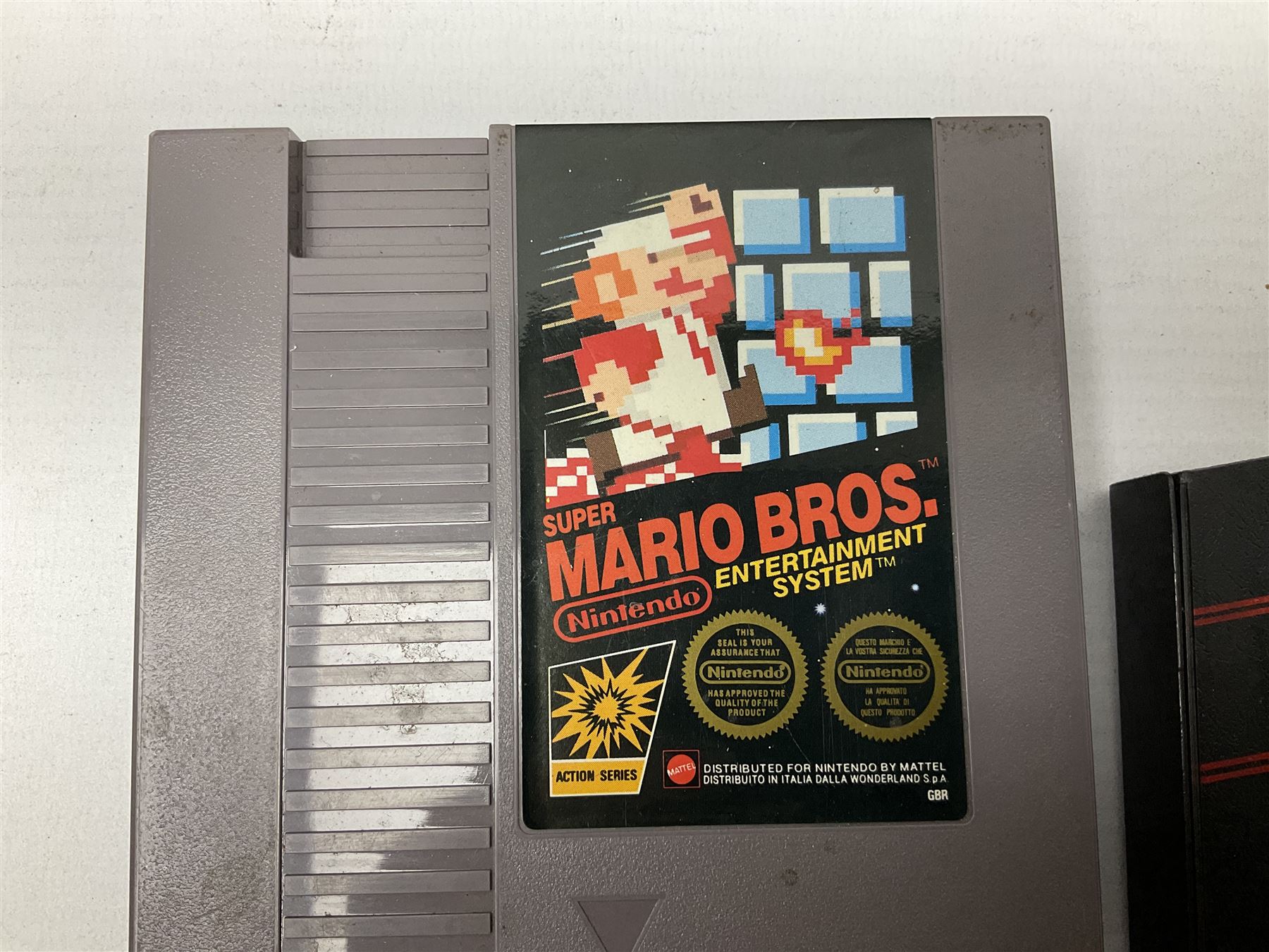 Nintendo Entertainment System (1985) console with two controllers, accessories and instruction booklet. NES Games ‘Duck Hunt’ with Nintendo Zapper gun, ‘Pinball’ and ‘Super Mario Bros.’, all with original sleeves and instruction booklets. NES game ‘Super Mario Bros. 2’ cartridge only