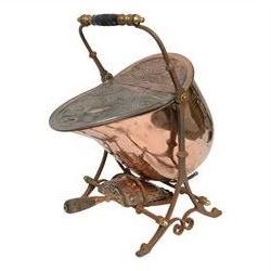 Victorian copper coal scuttle, the helmet shaped body tilting upon stand, with embossed hinged cover, turned wood handle and scoop H53cm
