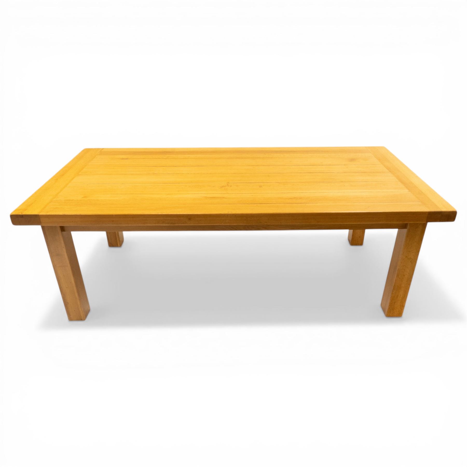 Late 20th century solid light oak dining table, on square supports